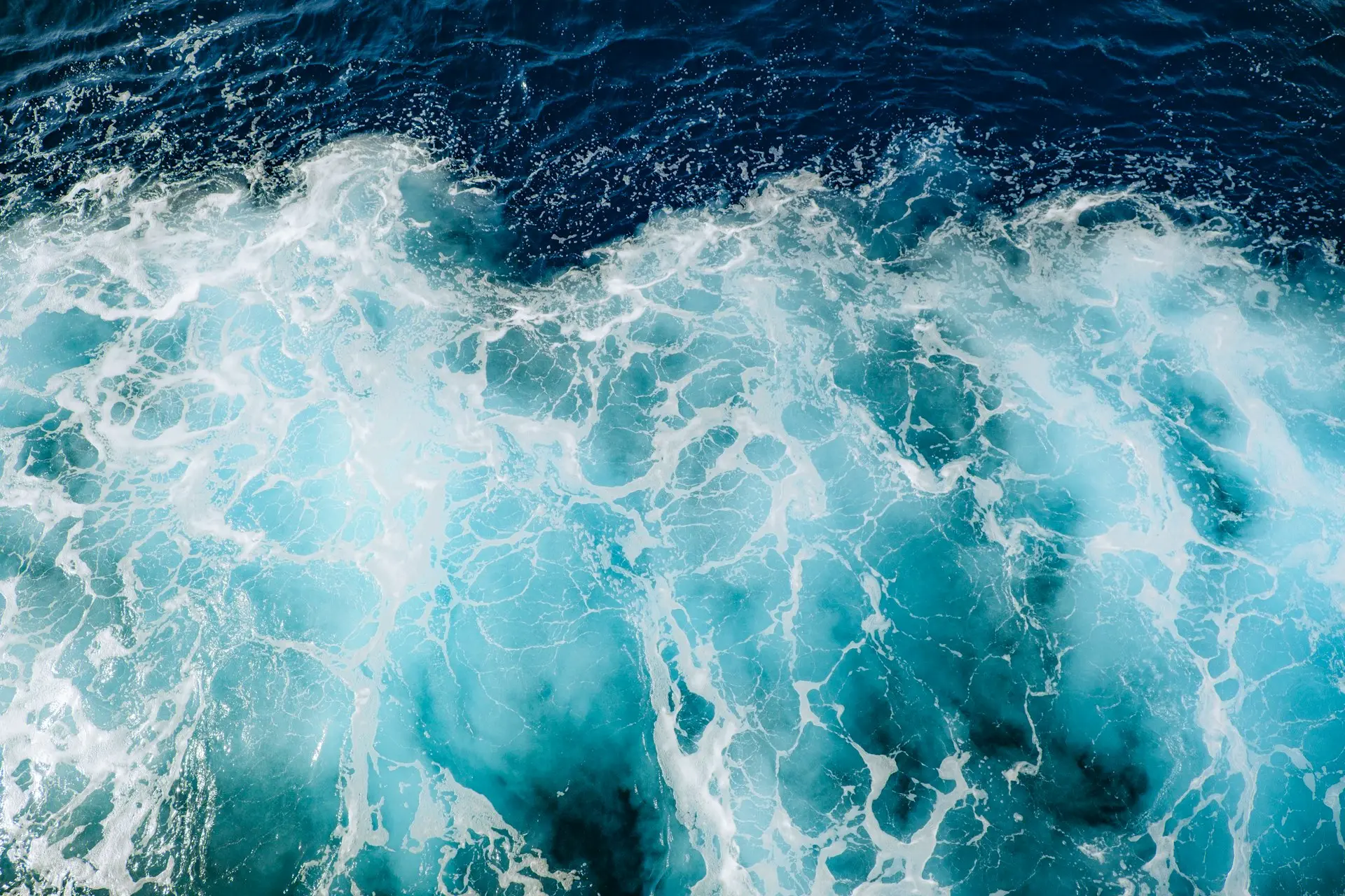 A large body of water covered in lots of blue water